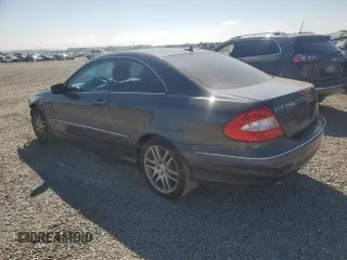 2009 Mercedes-Benz CLK 350 with VIN WDBTJ56H99F261060, listed as a Copart auction lot 69812004 with 105,218 mi miles and Salvage Title. Bid and sale history available at carsss.com. Image 2.