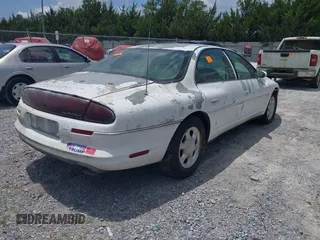 1999 Oldsmobile Aurora z VIN 1G3GR62CXX4100897, wystawiony jako IAAI lot #42277912 z przebiegiem 179 680 mil mil oraz . Historia ofert i sprzedaży dostępna na DreamBid. Obrazek 4.