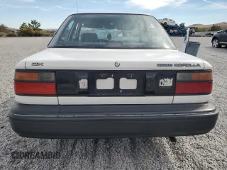 1990 Toyota Corolla z VIN 1NXAE94A0LZ089770, wystawiony jako Copart lot #75318334 z przebiegiem 161 894 mil mil oraz Szkoda całkowita • Salvage title. Historia ofert i sprzedaży dostępna na DreamBid. Obrazek 6.