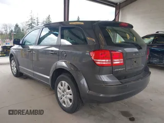2015 Dodge Journey SE z VIN 3C4PDCAB1FT617794, wystawiony jako IAAI lot #41922371 z przebiegiem 130 558 mil mil oraz . Historia ofert i sprzedaży dostępna na DreamBid. Obrazek 3.