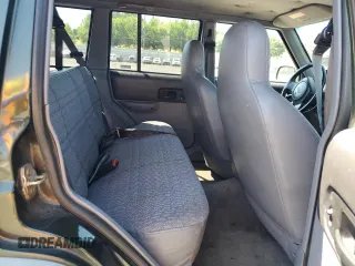 1998 Jeep Cherokee Sport with VIN 1J4FJ68S5WL108020, listed as a Copart auction lot 60150655 with 290,595 mi miles and Salvage title. Bid and sale history available at DreamBid. Image 11.