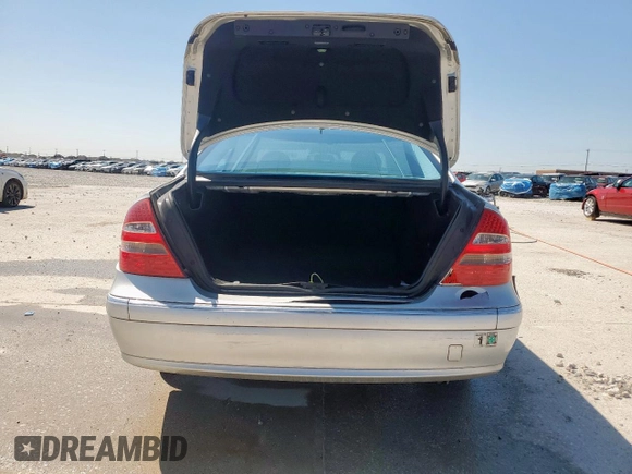 2005 Mercedes-Benz E 5.0L with VIN WDBUF70J95A718132, listed as a Copart auction lot 51620185 with 249,876 mi miles and Salvage Title. Bid and sale history available at carsss.com. Image 6.