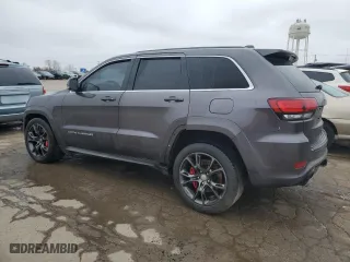 2015 Jeep Grand Cherokee SRT with VIN 1C4RJFDJ8FC752210, listed as a Copart auction lot 45694094 with 76,721 mi miles and Salvage Title. Bid and sale history available at carsss.com. Image 2.