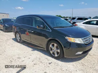 2011 Honda Odyssey Touring with VIN 5FNRL5H90BB033700, listed as a Copart auction lot 58602835 with 197,063 mi miles and Clean title. Bid and sale history available at DreamBid. Image 4.