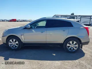 2015 Cadillac SRX Luxury Collection z VIN 3GYFNBE38FS641807, wystawiony jako IAAI lot #41669512 z przebiegiem 147 889 mil mil oraz . Historia ofert i sprzedaży dostępna na DreamBid. Obrazek 14.