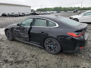 2024 BMW i4 eDrive35 with VIN WBY43AW05RFS84773, listed as a Copart auction lot 54974024 with 2,942 mi miles and Salvage Title. Bid and sale history available at carsss.com. Image 2.