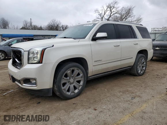 2015 GMC Yukon Denali with VIN 1GKS1CKJ1FR619793, listed as a Copart auction lot 86910314 with 128,559 mi miles and Salvage Title. Bid and sale history available at carsss.com. Image 1.