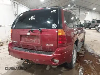 2006 GMC Envoy SLT with VIN 1GKDS13S362135683, listed as a IAAI auction lot 41477501 with 214,760 mi miles. Bid and sale history available at carsss.com. Image 4.