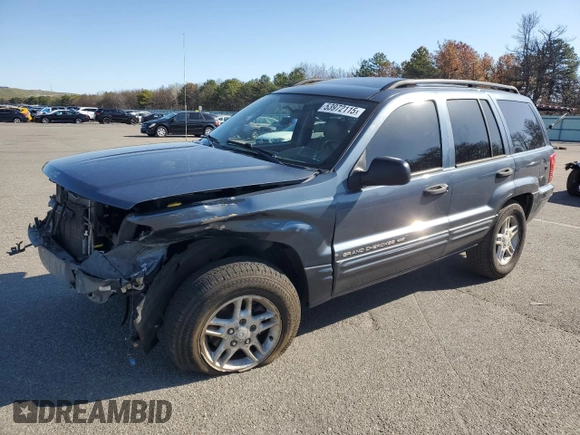2004 Jeep Grand Cherokee Laredo z VIN 1J4GW48S74C159381, wystawiony jako Copart lot #53972115 z przebiegiem 128 309 mil mil oraz Szkoda całkowita • Salvage title. Historia ofert i sprzedaży dostępna na DreamBid. Obrazek 1.