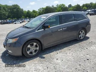 2012 Honda Odyssey Touring with VIN 5FNRL5H92CB134903, listed as a Copart auction lot 59745015 with 188,666 mi miles and Clean title. Bid and sale history available at DreamBid. Image 1.