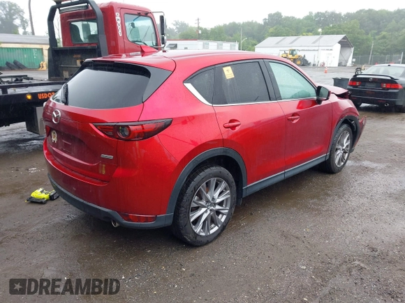 2019 Mazda CX-5 Grand Touring with VIN JM3KFBDM8K0693622, listed as a IAAI auction lot 42503818 with 60,812 mi miles and . Bid and sale history available at DreamBid. Image 4.