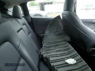 2024 Tesla Model Y Long Range с VIN 7SAYGDEE6RF128495, выставлен на аукционе Copart как лот 61127095 с пробегом Не указан миль и Списание • Salvage title. История ставок и продаж доступна на DreamBid. Изображение 10.