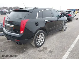 2015 Cadillac SRX Performance Collection with VIN 3GYFNFE35FS546905, listed as a IAAI auction lot 41588405 with 145,620 mi miles. Bid and sale history available at carsss.com. Image 4.