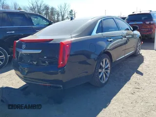 2013 Cadillac XTS Luxury z VIN 2G61R5S33D9184878, wystawiony jako IAAI lot #41644213 z przebiegiem 113 293 mil mil oraz . Historia ofert i sprzedaży dostępna na DreamBid. Obrazek 4.
