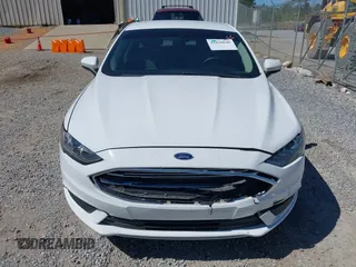 2018 Ford Fusion SE z VIN 3FA6P0H77JR142828, wystawiony jako IAAI lot #41820649 z przebiegiem 208 517 mil mil oraz . Historia ofert i sprzedaży dostępna na DreamBid. Obrazek 12.
