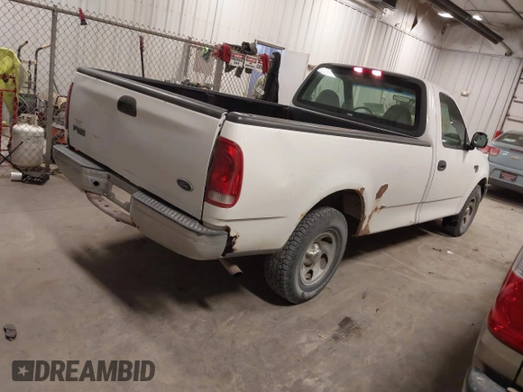 2000 Ford F-150 XL with VIN 1FTRF17W8YKB33949, listed as a IAAI auction lot 41519978 with 228,931 mi miles. Bid and sale history available at carsss.com. Image 4.