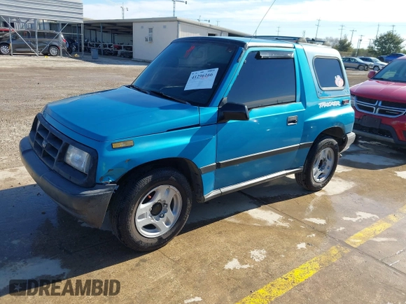 1997 Chevrolet Tracker z VIN 2CNBE1865V6904672, wystawiony jako IAAI lot #41296166 z przebiegiem 266 743 mil mil oraz . Historia ofert i sprzedaży dostępna na DreamBid. Obrazek 2.