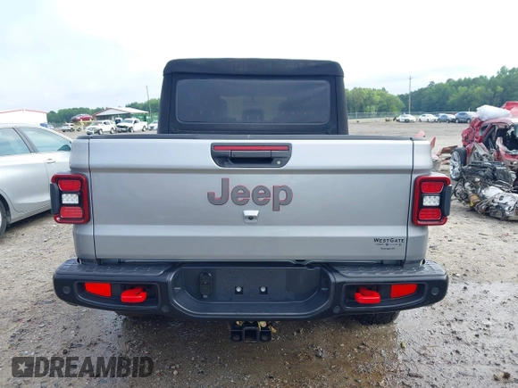 2020 Jeep Gladiator Rubicon z VIN 1C6JJTBG7LL181833, wystawiony jako IAAI lot #42493073 z przebiegiem 13 775 mil mil oraz . Historia ofert i sprzedaży dostępna na DreamBid. Obrazek 16.