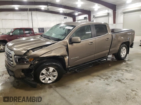 2015 GMC Canyon 4WD SLE z VIN 1GTG6BE3XF1242163, wystawiony jako Copart lot #57132035 z przebiegiem 110 241 mil mil oraz Szkoda całkowita • Salvage title. Historia ofert i sprzedaży dostępna na DreamBid. Obrazek 1.
