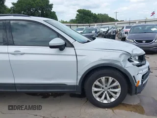 2018 Volkswagen Tiguan S with VIN 3VV1B7AX0JM092116, listed as a IAAI auction lot 42388339 with 103,412 mi miles and . Bid and sale history available at DreamBid. Image 6.