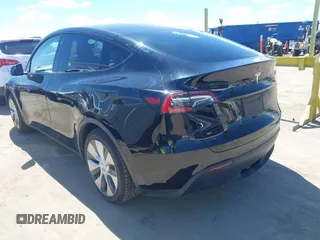 2020 Tesla Model Y Long Range with VIN 5YJYGDEE2LF059177, listed as a IAAI auction lot 41916260 with 66,190 mi miles and . Bid and sale history available at DreamBid. Image 3.
