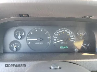 1999 Jeep Grand Cherokee Laredo with VIN 1J4GW58N4XC739465, listed as a Copart auction lot 76130544 with 195,649 mi miles and Salvage title. Bid and sale history available at DreamBid. Image 9.