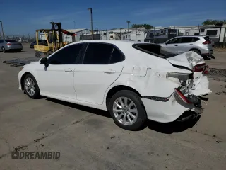 2018 Toyota Camry LE с VIN 4T1B11HK5JU073663, выставлен на аукционе Copart как лот 55656575 с пробегом 100 578 миль миль и Списание • Salvage title. История ставок и продаж доступна на DreamBid. Изображение 2.