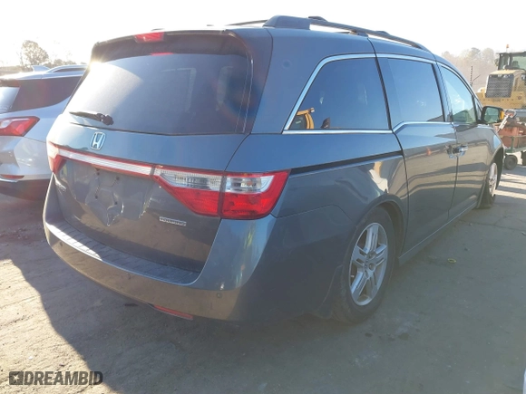 2013 Honda Odyssey Touring with VIN 5FNRL5H9XDB009973, listed as a IAAI auction lot 41904710 with 219,067 mi miles. Bid and sale history available at carsss.com. Image 4.