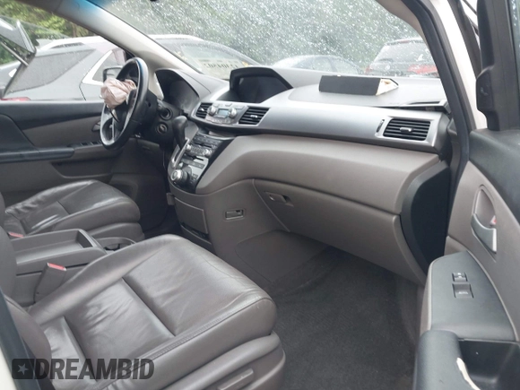 2012 Honda Odyssey Touring with VIN 5FNRL5H93CB034485, listed as a IAAI auction lot 42304502 with 198,589 mi miles and . Bid and sale history available at DreamBid. Image 5.