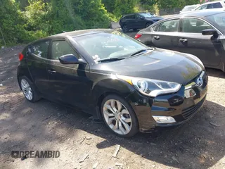 2013 Hyundai Veloster w/Black Int with VIN KMHTC6AD2DU120059, listed as a IAAI auction lot 42355902 with 81,221 mi miles and . Bid and sale history available at DreamBid. Image 1.