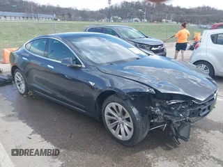 2016 Tesla Model S 70 with VIN 5YJSA1E14GF157118, listed as a IAAI auction lot 41794381 with 53,651 mi miles and . Bid and sale history available at DreamBid. Image 1.