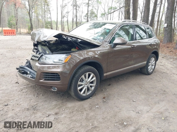 2014 Volkswagen Touareg Sport with VIN WVGEF9BP2ED007904, listed as a IAAI auction lot 41960811 with 126,230 mi miles and . Bid and sale history available at DreamBid. Image 19.