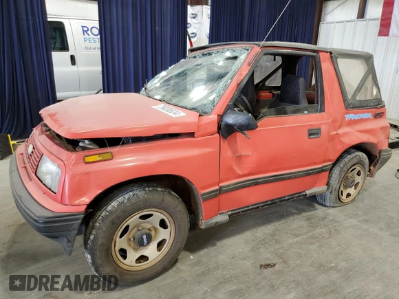 1994 Geo Tracker z VIN 2CNBE18U3R6952403, wystawiony jako Copart lot #79038524 z przebiegiem 271 461 mil mil oraz Szkody całkowita. Historia ofert i sprzedaży dostępna na DreamBid. Obrazek 1.