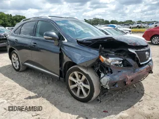 2011 Lexus RX 350 with VIN JTJZK1BA2B2410994, listed as a Copart auction lot 59999763 with 124,972 mi miles and Salvage Title. Bid and sale history available at DreamBid. Image 4.