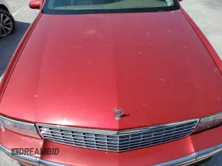 1995 Cadillac DeVille z VIN 1G6KD52B5SU263656, wystawiony jako Copart lot #83631284 z przebiegiem Nie podano mil oraz Szkoda całkowita • Salvage title. Historia ofert i sprzedaży dostępna na DreamBid. Obrazek 12.