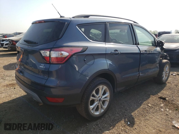 2018 Ford Escape SE z VIN 1FMCU9GD3JUA98865, wystawiony jako Copart lot #56842065 z przebiegiem 112 439 mil mil oraz Szkoda całkowita • Salvage title. Historia ofert i sprzedaży dostępna na DreamBid. Obrazek 3.