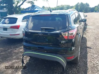2018 Ford Escape Titanium with VIN 1FMCU9J94JUC98805, listed as a IAAI auction lot 42718214 with 36,689 mi miles and . Bid and sale history available at DreamBid. Image 16.