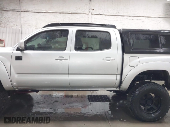 2011 Toyota Tacoma with VIN 3TMLU4EN9BM070836, listed as a IAAI auction lot 41668595 with 89,879 mi miles and . Bid and sale history available at DreamBid. Image 14.