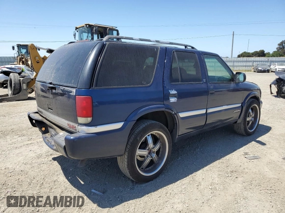 2001 GMC Jimmy SLE Rental Fleet z VIN 1GKDT13W212108144, wystawiony jako Copart lot #58753865 z przebiegiem 254 402 mil mil oraz Szkoda całkowita • Salvage title. Historia ofert i sprzedaży dostępna na DreamBid. Obrazek 3.
