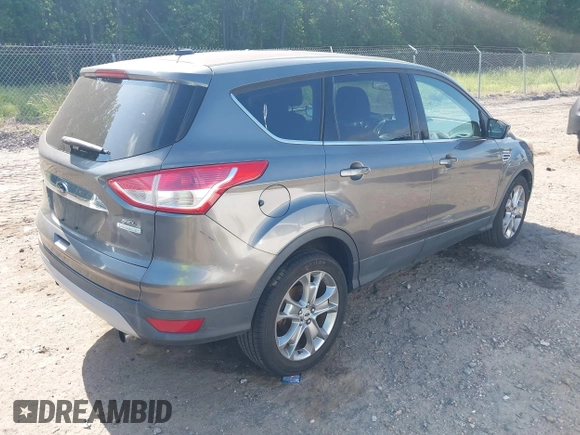 2013 Ford Escape SEL with VIN 1FMCU0H9XDUA14051, listed as a IAAI auction lot 42171703 with 193,988 mi miles. Bid and sale history available at carsss.com. Image 4.