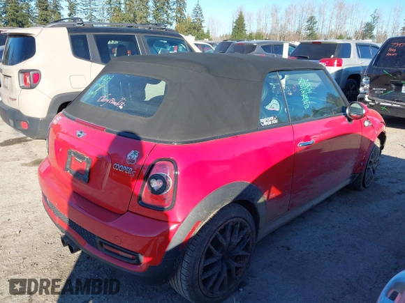 2013 MINI Convertible S with VIN WMWZP3C55DT705938, listed as a IAAI auction lot 41372294 with 118,481 mi miles and . Bid and sale history available at DreamBid. Image 4.