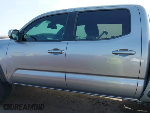 2018 Toyota Tacoma SR5 with VIN 3TMAZ5CN0JM053861, listed as a IAAI auction lot 41920377 with 104,015 mi miles and . Bid and sale history available at DreamBid. Image 14.