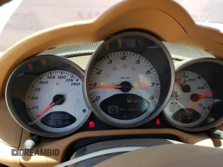 2006 Porsche Cayman S с VIN WP0AB29806U785415, выставлен на аукционе Copart как лот 52888794 с пробегом 106 896 миль миль и Списание • Salvage title. История ставок и продаж доступна на DreamBid. Изображение 9.