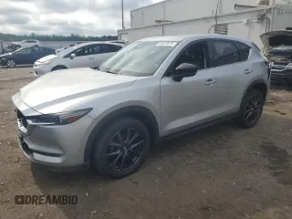 2018 Mazda CX-5 Grand Touring with VIN JM3KFBDM9J0341518, listed as a Copart auction lot 64829075 with 124,131 mi miles and Salvage title. Bid and sale history available at DreamBid. Image 1.