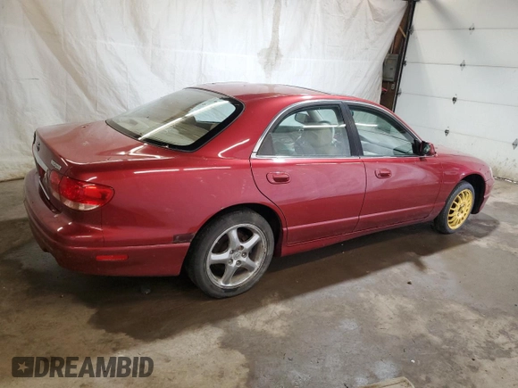 2001 Mazda Millenia S z VIN JM1TA222111707236, wystawiony jako Copart lot #54690874 z przebiegiem 107 530 mil mil oraz Szkoda całkowita • Salvage title. Historia ofert i sprzedaży dostępna na DreamBid. Obrazek 3.