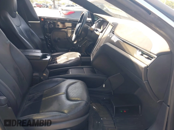 2014 Tesla Model S P85D with VIN 5YJSA1H25EFP65571, listed as a IAAI auction lot 42185442 with 115,990 mi miles and . Bid and sale history available at DreamBid. Image 5.