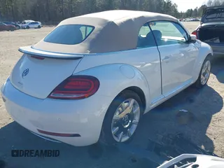 2018 Volkswagen Beetle S with VIN 3VW5DAAT1JM506988, listed as a IAAI auction lot 41589324 with 50,873 mi miles and . Bid and sale history available at DreamBid. Image 4.