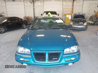 1994 Pontiac Grand Am z VIN 1G2NE15M5RM500643, wystawiony jako IAAI lot #42069901 z przebiegiem 77 129 mil mil oraz . Historia ofert i sprzedaży dostępna na DreamBid. Obrazek 12.