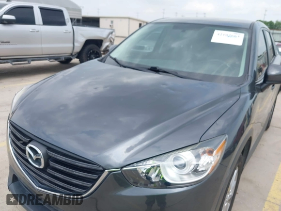 2016 Mazda CX-5 Sport with VIN JM3KE4BY8G0921243, listed as a IAAI auction lot 42102663 with 111,960 mi miles and . Bid and sale history available at DreamBid. Image 6.