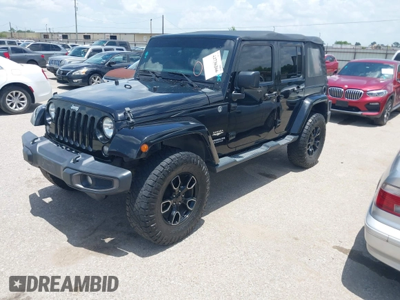 2015 Jeep Wrangler Unlimited Sahara with VIN 1C4HJWEG6FL572674, listed as a IAAI auction lot 42736266 with 97,024 mi miles and . Bid and sale history available at DreamBid. Image 17.